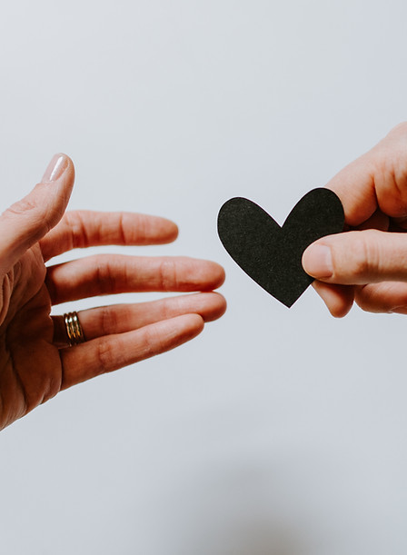 Man handing a woman a heart shape_edited
