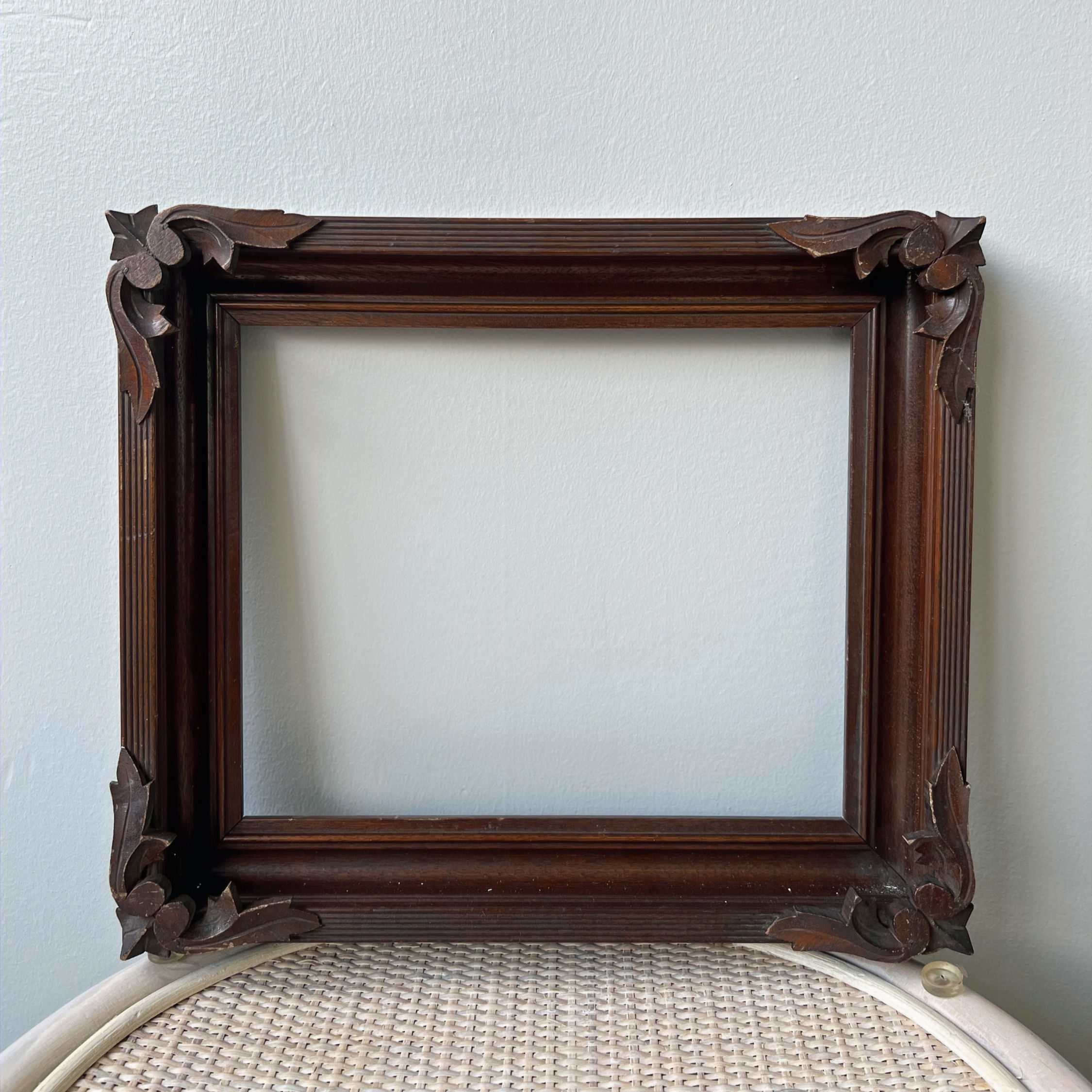 thick wooden frame, small - ornate corner details