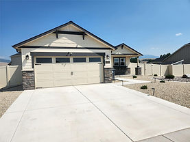 This thoughtfully designed 3-bedroom, 2-bathroom home sits on a 9,322 sq. ft. lot and offers the ease and comfort of main-level living, anchored by an expansive primary suite and two additional spacious bedrooms. The well-appointed second bathroom offers plenty of room and function for family or guests. Vaulted ceilings in the living and dining areas add a touch of elegance to this thoughtfully laid-out floor plan, while the kitchen impresses with beautiful cabinetry and ample storage for all your culinary needs. No detail was overlooked — central air conditioning keeps you cool through the summer months, while the beautifully landscaped yard, complete with carefree underground sprinklers and a privacy fence, creates your own backyard retreat. Step out onto the back patio for morning coffee or relaxed summer evenings. A 2-car garage rounds out the package, with plenty of room for vehicles and storage. Just minutes from Missoula, this new community will offer walking trails and multiple parks, and it's located in the highly sought-after Frenchtown School District! This lovely home has been perfectly placed on the lot for maximum privacy.