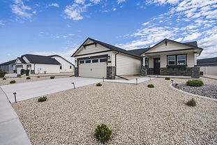 This beautifully designed home offers the ease and comfort of main-level living, anchored by an expansive primary suite and two additional spacious bedrooms. The well-appointed second bathroom offers plenty of space and function for family or guests. Vaulted ceilings in the living and dining areas add a touch of elegance to this thoughtfully laid-out floor plan, while the kitchen impresses with beautiful cabinetry and ample storage for all your culinary needs. No detail was overlooked: central air conditioning keeps you cool through summer, while the beautifully landscaped yard — complete with carefree underground sprinklers and a privacy fence — creates your own backyard retreat. Step out onto the back patio for morning coffee or relaxed summer evenings. A 2-car garage rounds out the package with plenty of room for vehicles and storage. Just minutes from Missoula, this new community will offer walking trails and multiple parks, and it is located in the highly sought-after Frenchtown School District!