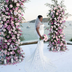Bride in a white wedding gown with radiant makeup at an outdoor Phuket wedding