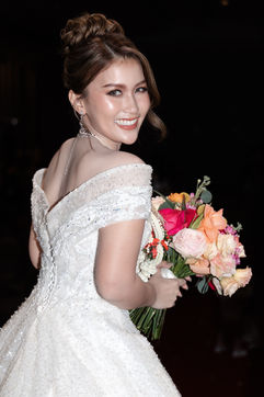 Bride with soft glam makeup, glowing complexion, and elegant bridal hairstyle