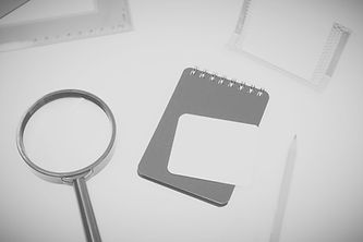 black magnifying glass on white paper_edited_edited_edited_edited.jpg
