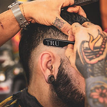 man in black shirt with tattoo on his left arm_edited.jpg