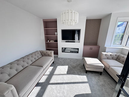 Modern living room renovation with built-in media unit, bespoke shelving and seating