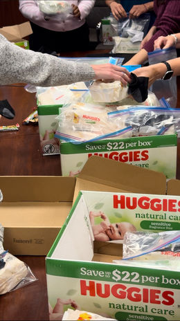 Volunteers packing donation bags for Shine A Light 