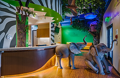 Agave Pediatrics Glendale Location lobby showing two elephants and rainforest decor