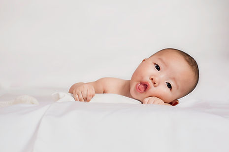 Cute baby sticking tongue out