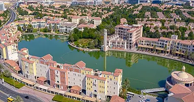 Aerial view of Dubai Investment Park mixed-use free zone with Green Community villas and Ritaj apartments in Dubai – area guide