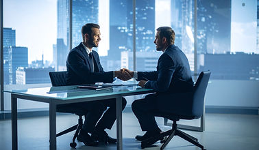 Mitchell's Commercial Real Estate's commercial property experts at the table at an office in Dubai discussing a deal