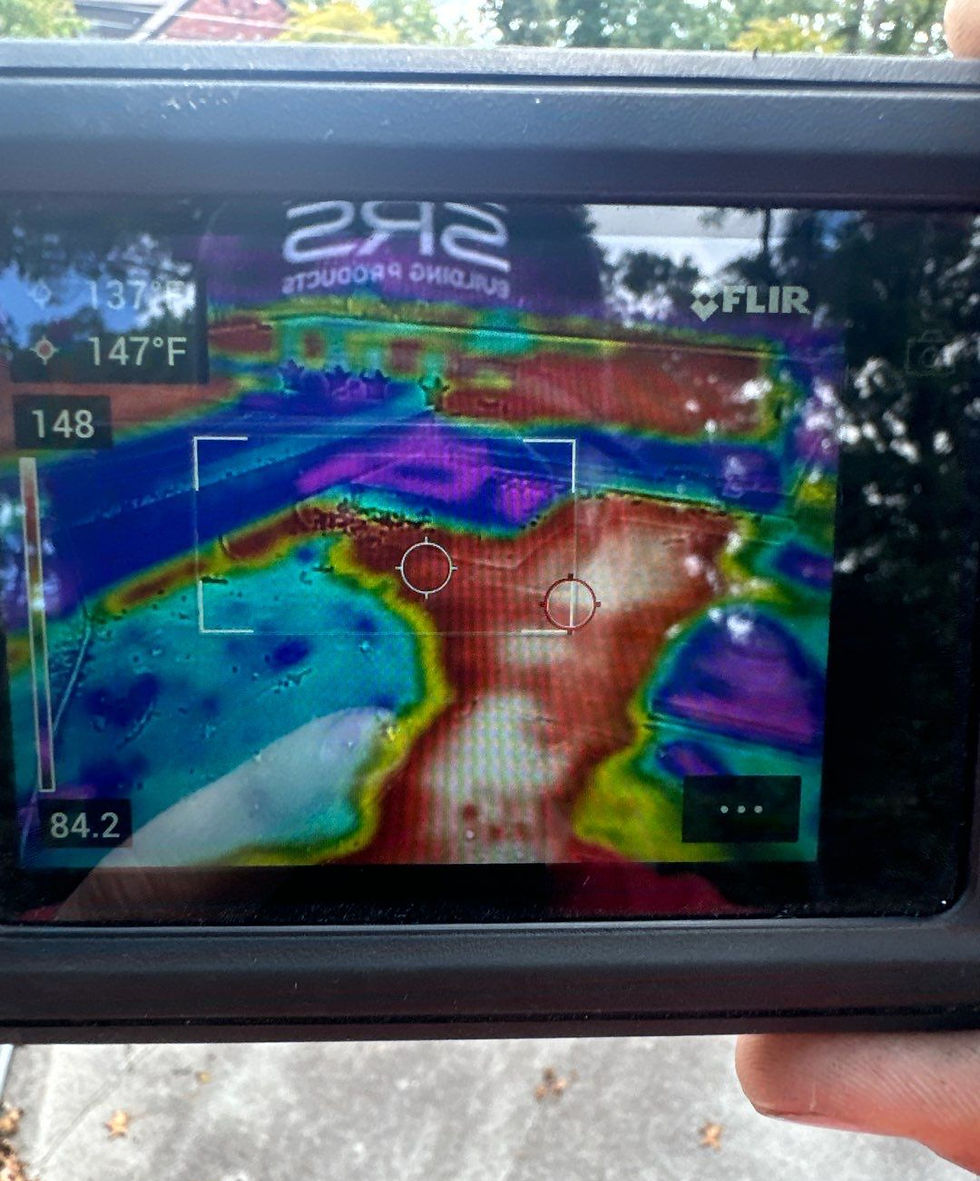 Thermal moisture scan identifying trapped moisture under an aging commercial roof in Longview, Texas.