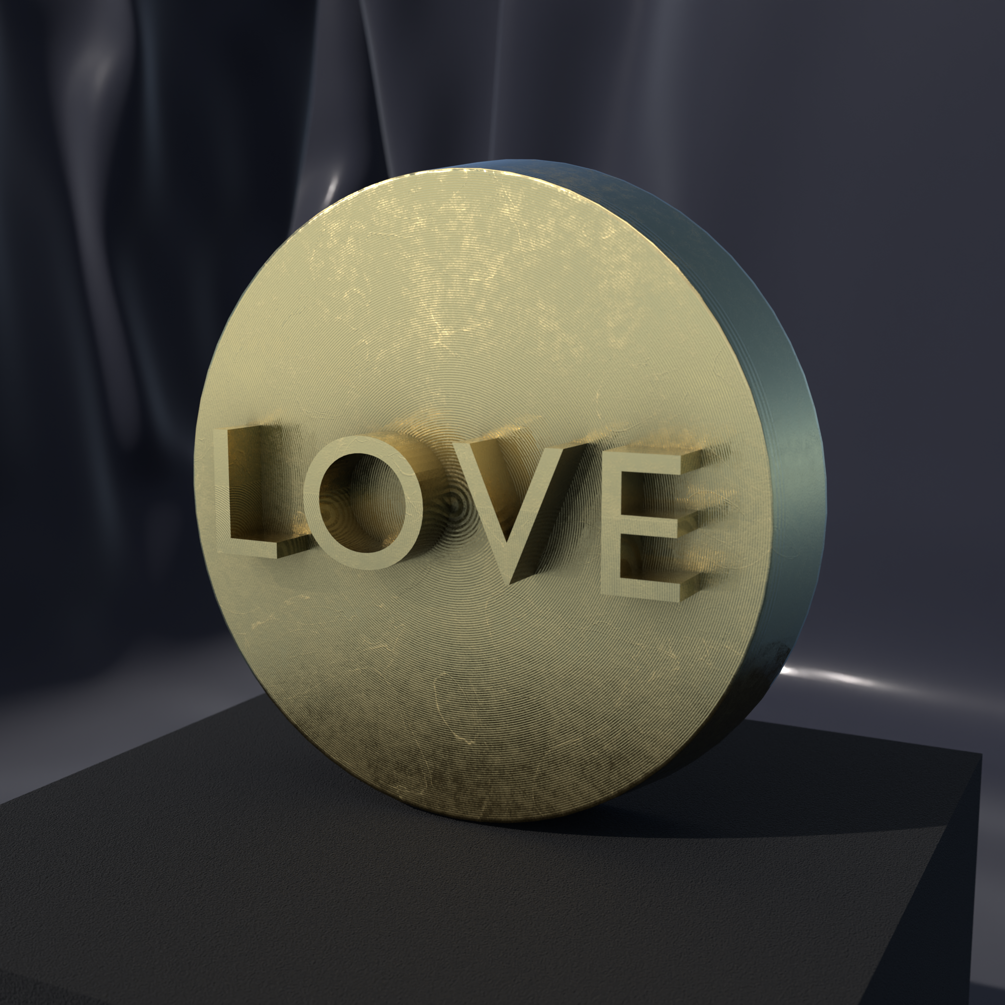 LOVE Word medallion in Nordic Gold, front view of the relief design