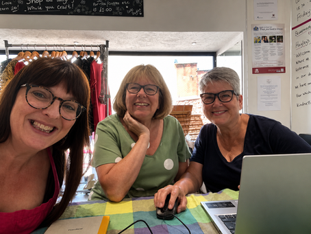 Three women smiling enthusiatically