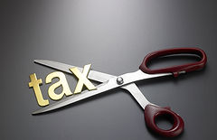 close-up-tax-text-with-scissor-gray-background.jpg