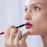 Model Applying Lipstick