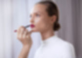 Model Applying Lipstick