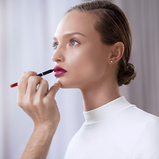 Model Applying Lipstick