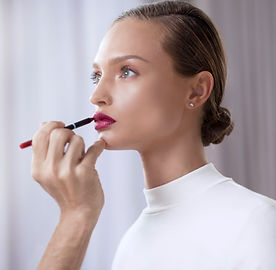 Model Applying Lipstick