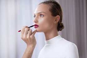 Model Applying Lipstick