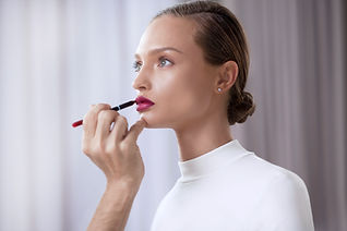 Model Applying Lipstick