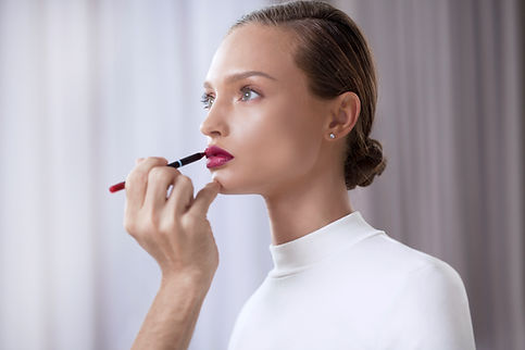 Model Applying Lipstick
