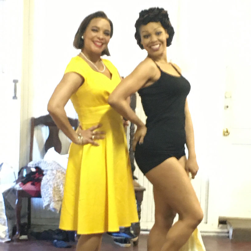 Two women in vintage dresses