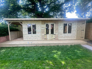 picture of a wooden summerhouse with a shed storage section and gazebo area