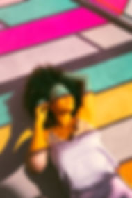 black woman with pink blue hues.jpeg