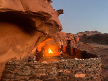 Bedouin cave with traditional fire and food at the sunrise