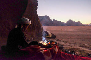 Morning view of sunrise in Wadi Rum from cave with Bedouin guide
