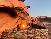 Bedouin cave with traditional fire and food at the sunrise