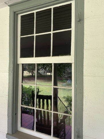 There are serveral 19th century cylinder glass panes intact.