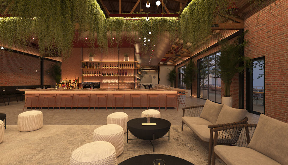 Lounge area and bar within the repurposed vintage industrial buildings, combining comfort and aesthetics - The Feel Interior Design Los Angeles