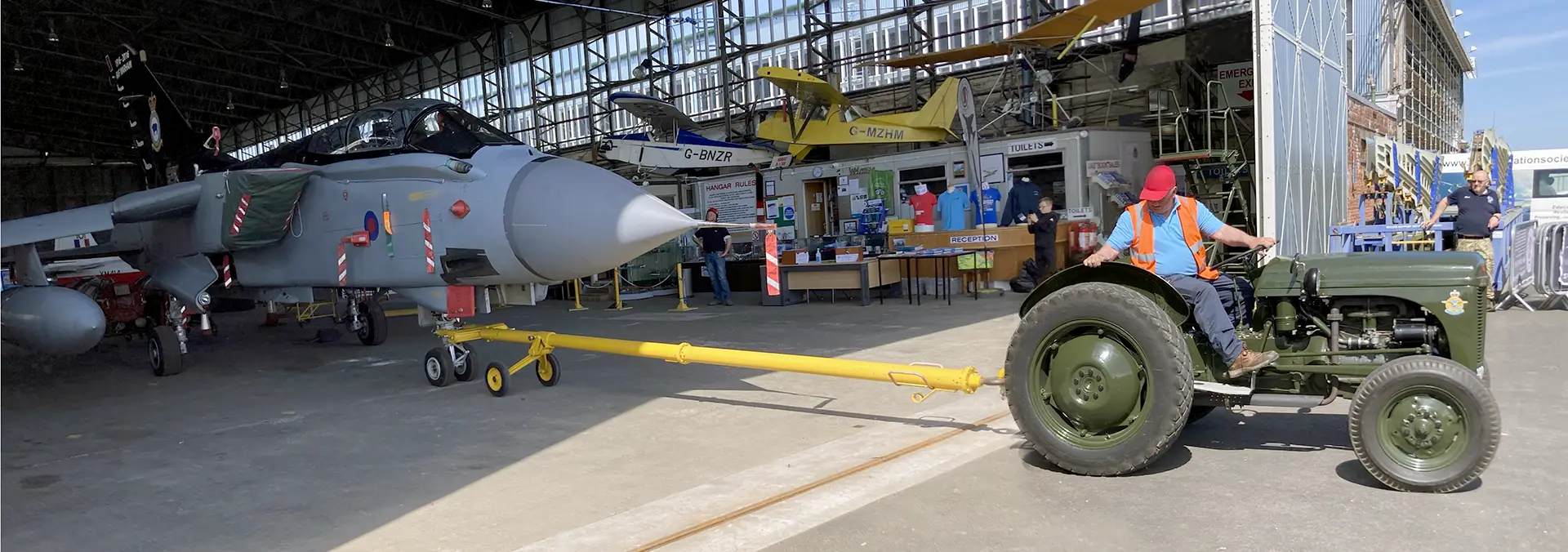 Tornado GR.4 ZG771 being towed by volunteer John Weir with a Ferguson TEA-20 tractor at the Ulster Aviation Society
