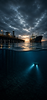 Maritime inspection operations beneath a commercial pier and cargo vessel