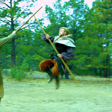 Zane Barber and John Davis fighting with quarterstaffs