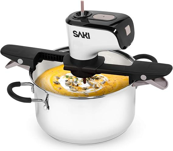 Automatic pot stirrer effortlessly stirs creamy soup in a stainless steel pot.