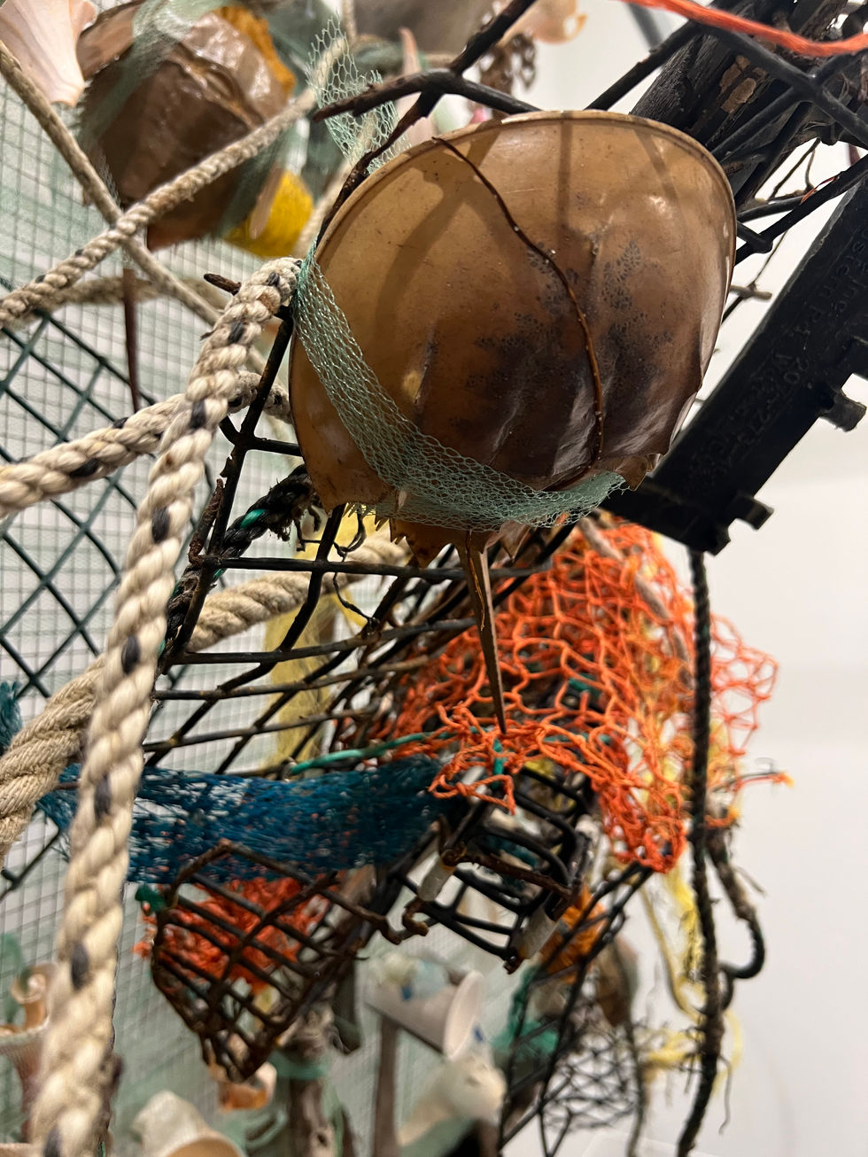 sculpture detail with crab and fishing net