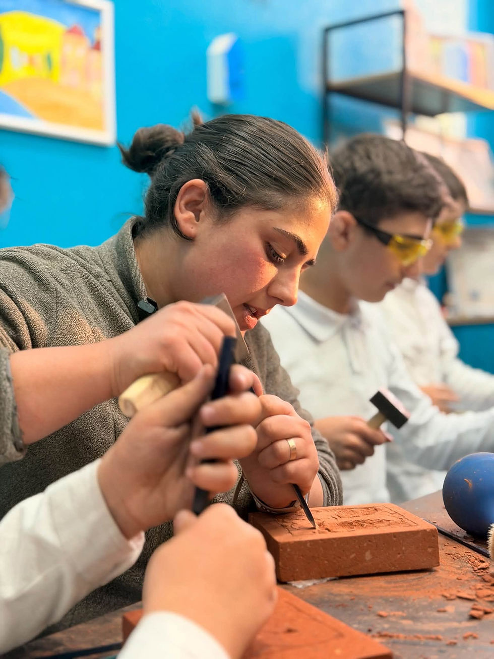 Master khachkar carver Narine Poladian visiting Artsakh Tsil Arts Studio in Gyumri, Armenia.
