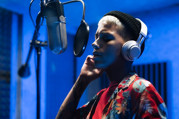 MaestroJnr singer at Microphone