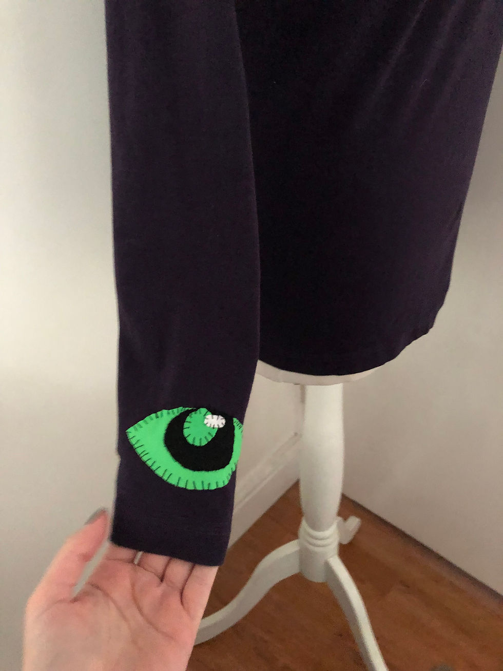 Thumbnail: purple and green eye turtle neck