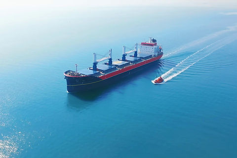 videoblocks-aerial-cinematic-4k-with-a-cargo-ship-at-sea_rayxhn2iin_thumbnail-1080_01_edited.jpg