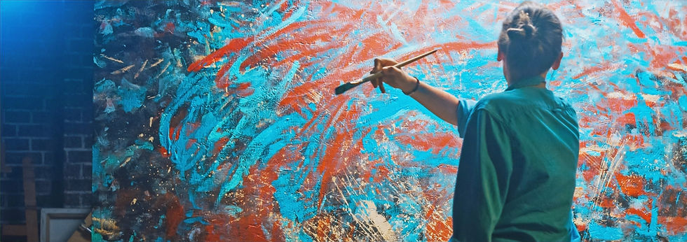 Person painting on a canvas, symbolizing Visioclara’s mission to help customers transform their vision into reality through creativity, clarity, and strategic guidance