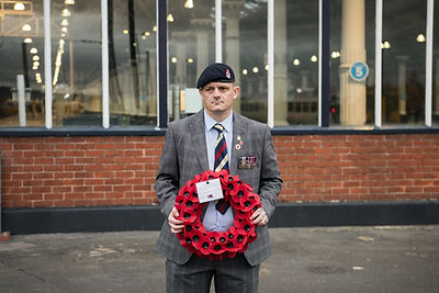 Portrait photography | Army veteran holding poppy wreath