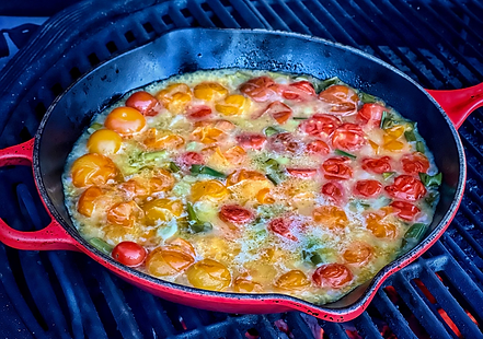 A vibrant, chunky sauce topping a broiled fish fillet. The sauce is composed of diced red tomatoes, minced green shallots, and whole briny capers, all glistening in a light olive oil and lemon juice glaze.