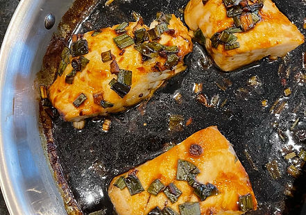 Gluten-Free Hong Kong Style Sea Bass served with soy sauce, ginger, and scallions.