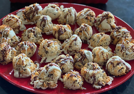 Chewy coconut macaroons with their bottoms dipped in rich, dark chocolate.