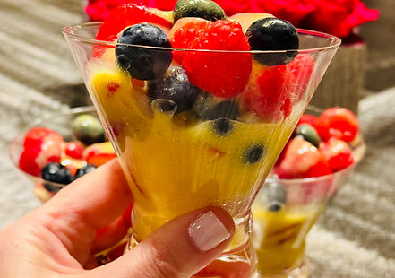 Creamy zabaglione, served warm in a cup and topped with fresh mixed berries, with a smooth, foamy, custardy texture.