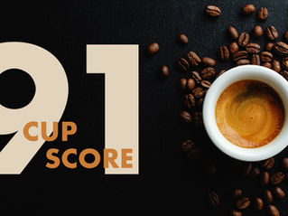 Image of espresso and coffee beans next to the words 91 cup score