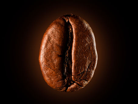 Image of a coffee bean with a glowing background